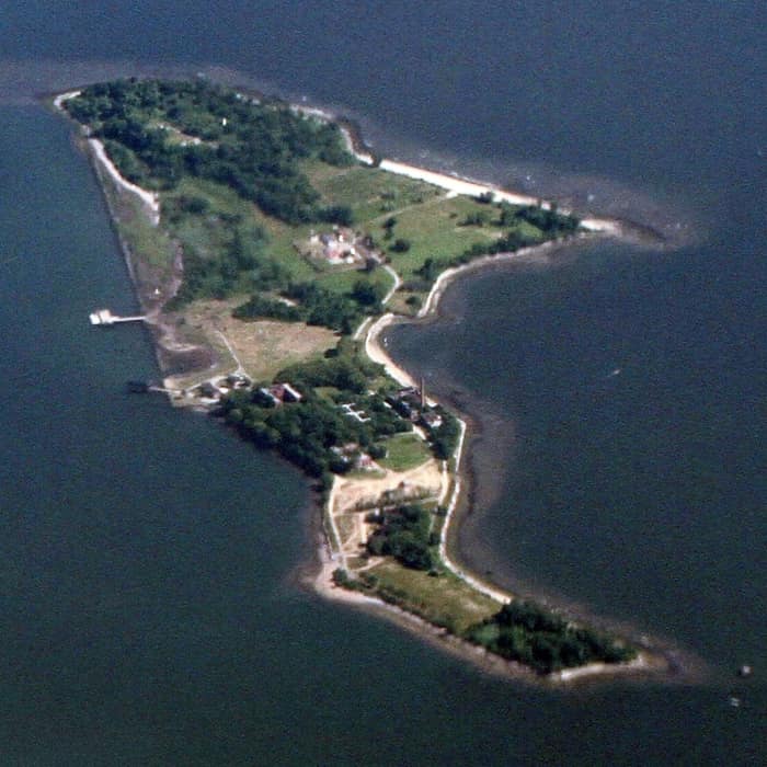 Hart Island in the Bronx seen across the water of Long Island Sound