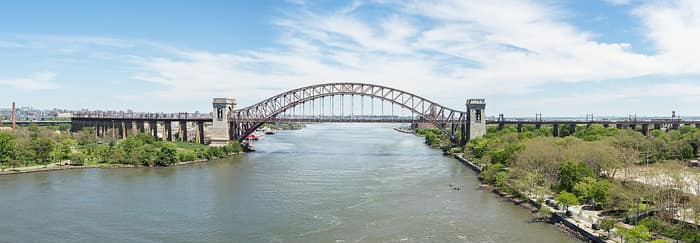 The Hell Gate Bridge, a steel arch railroad bridge over the East River in New York City