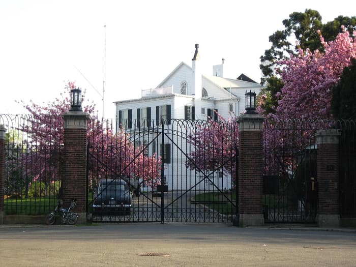 Quarters A, the Federal-style commandant’s house of the Brooklyn Navy Yard, seen among trees